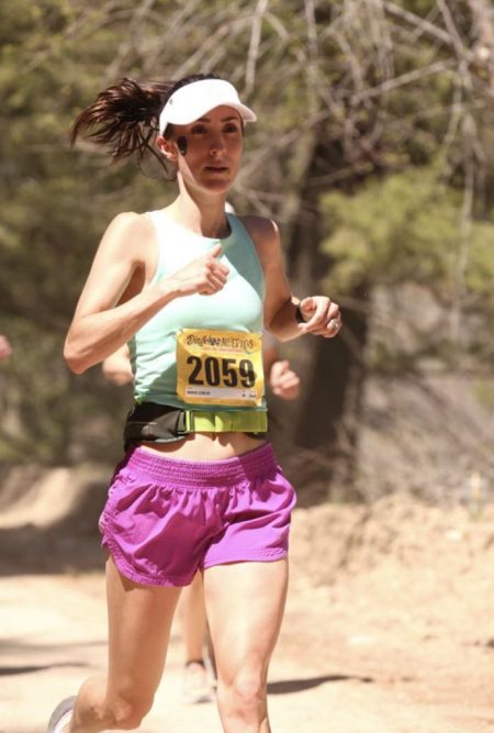 Dr. Leibler running in a race with a bib.